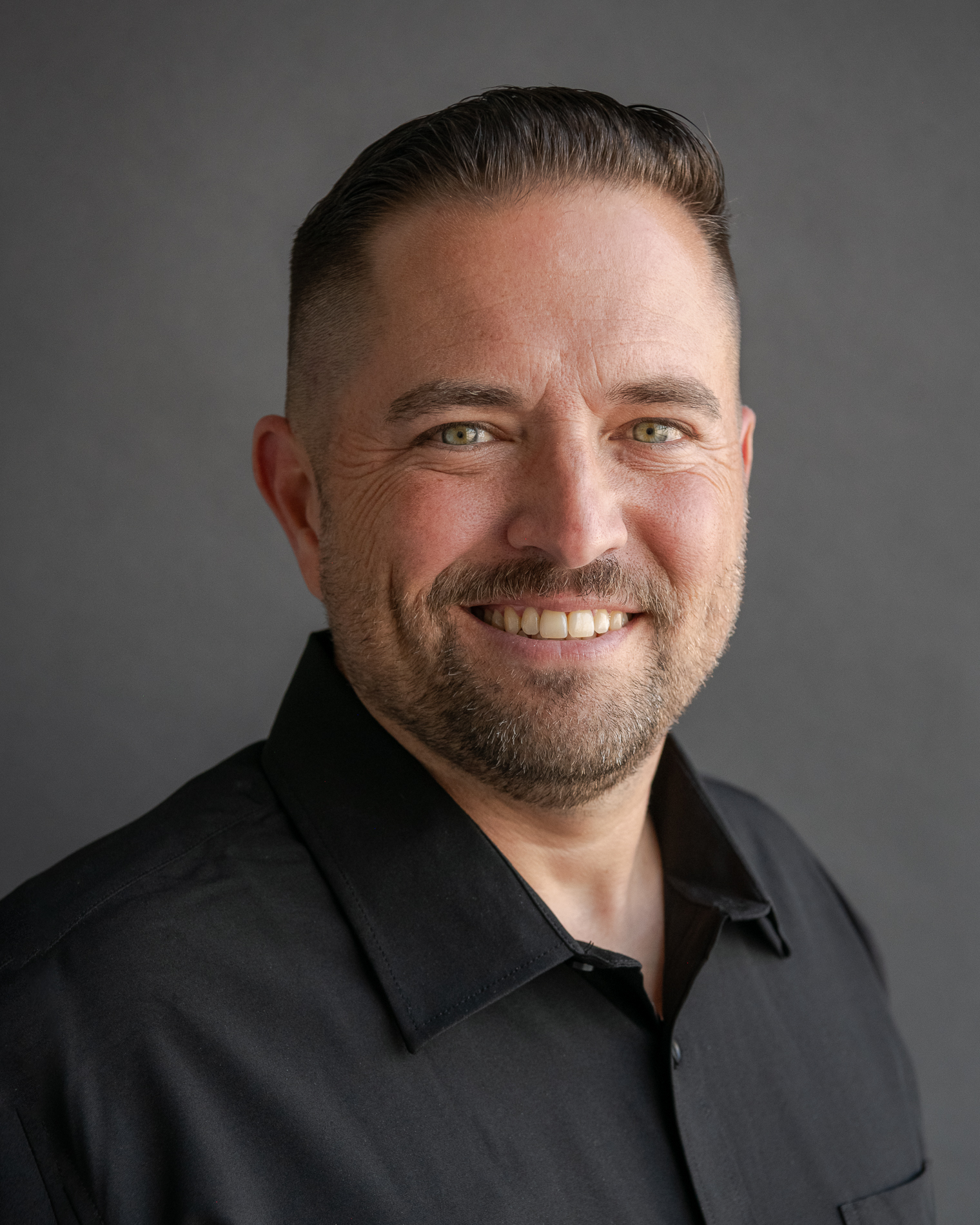 a headshot of Colin Delano